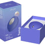 We-Vibe Temp verpakking met oranje stimulator en accessoires